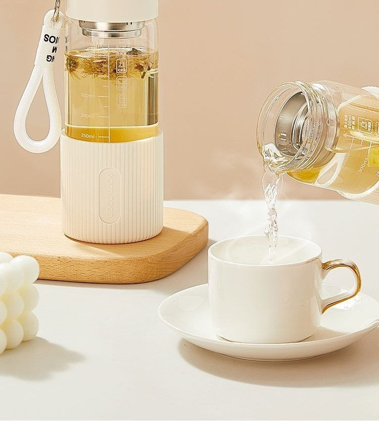 Glass water bottle with silicone sleeve by Glow Ritual