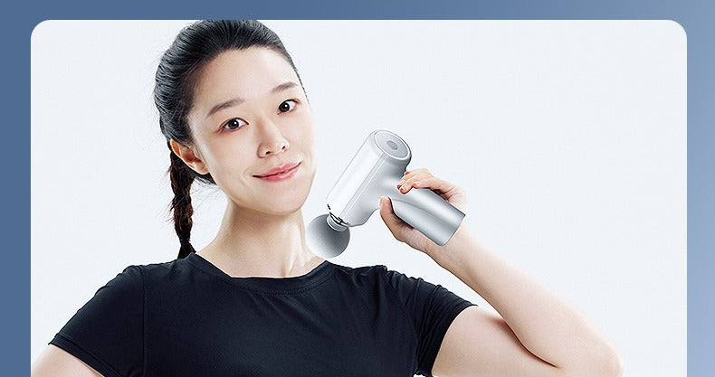 Mini portable massage gun by Glow Ritual