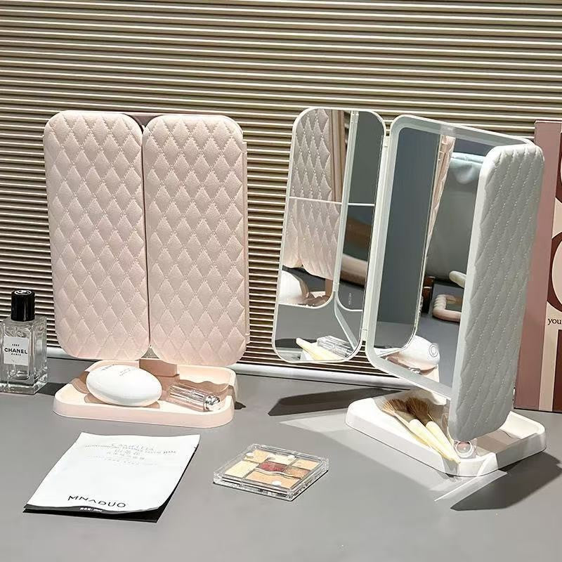 LED lighted tri-fold vanity mirror by Glow Ritual