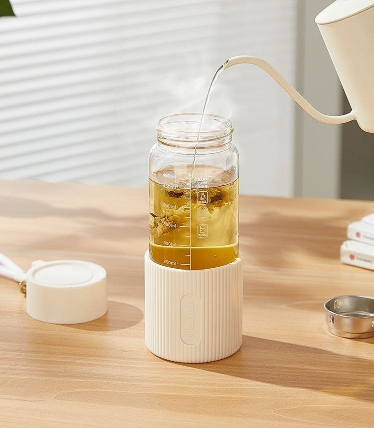 Glass water bottle with silicone sleeve by Glow Ritual