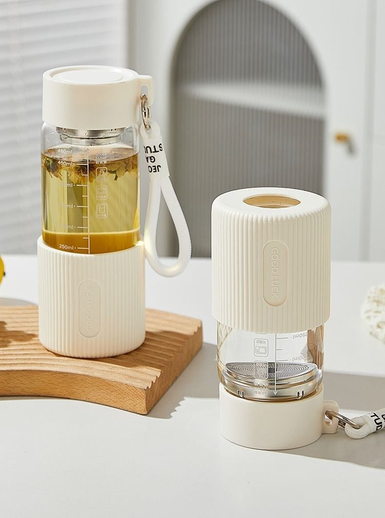 Glass water bottle with silicone sleeve by Glow Ritual