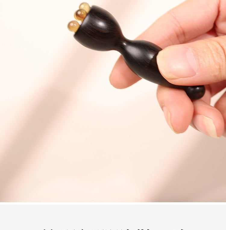 Sandalwood eye massage wand by Glow Ritual