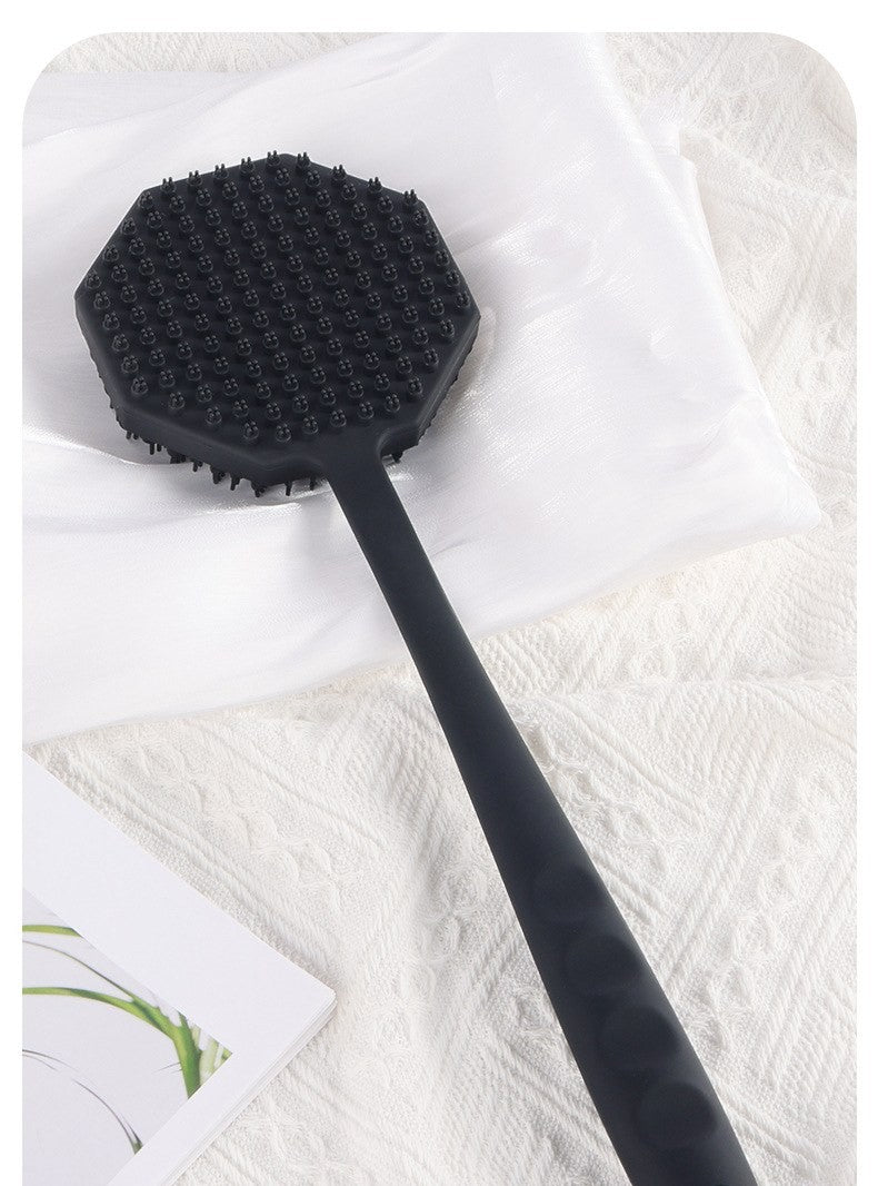 Long-handle silicone body scrubber by Glow Ritual