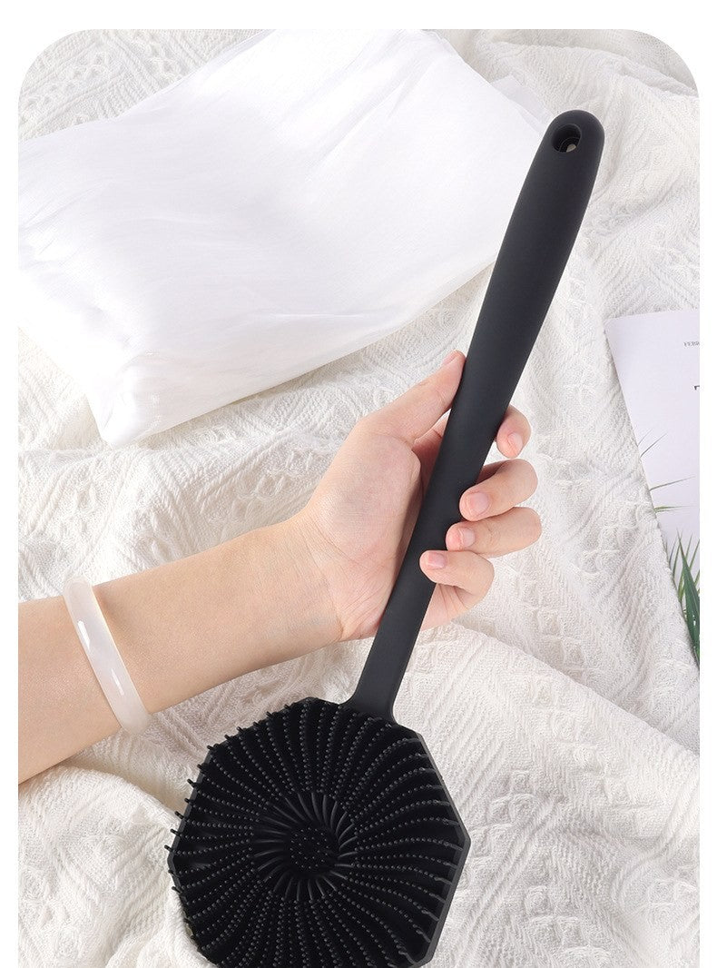 Long-handle silicone body scrubber by Glow Ritual