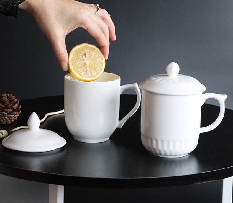 White ceramic mug with lid and spoon by Glow Ritual