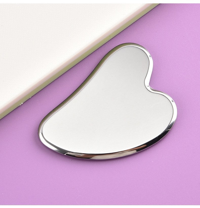Stainless steel gua sha tool by Glow Ritual
