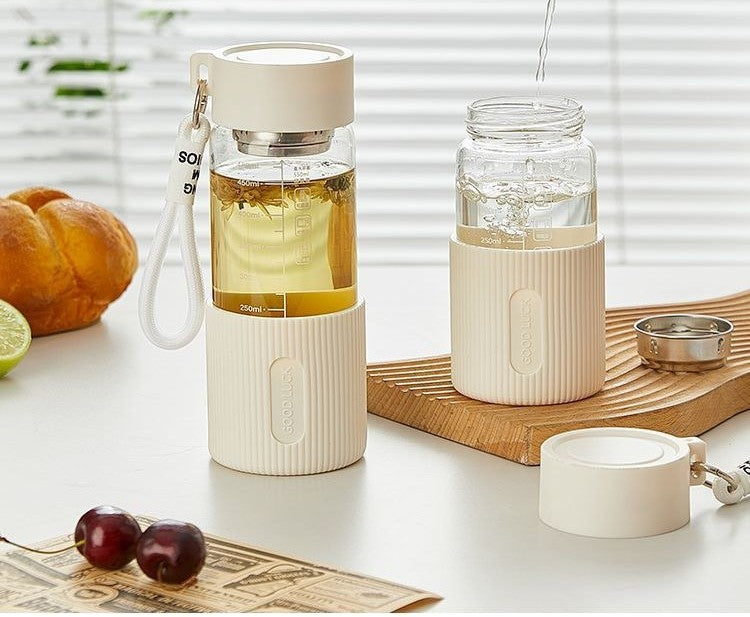 Glass water bottle with silicone sleeve by Glow Ritual