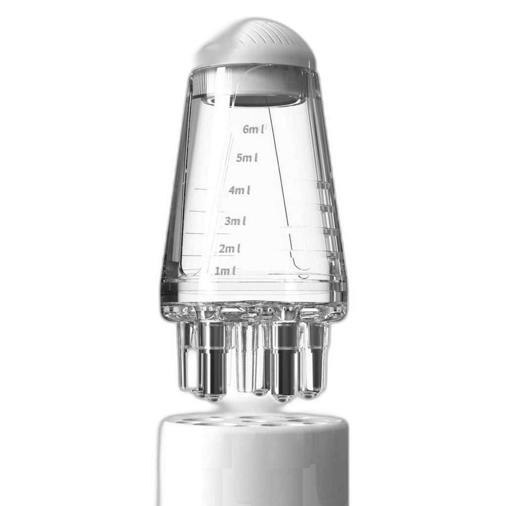 Scalp oil applicator comb by Glow Ritual