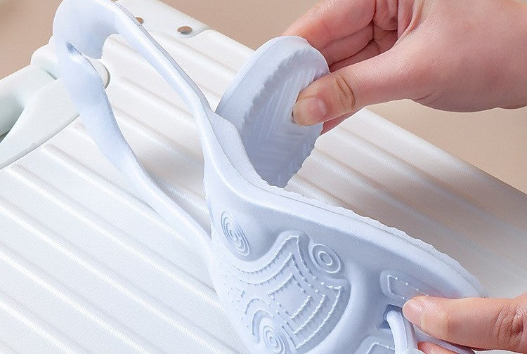 Folding travel slippers by Glow Ritual