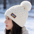 Fleece-lined pom beanie by Glow Ritual