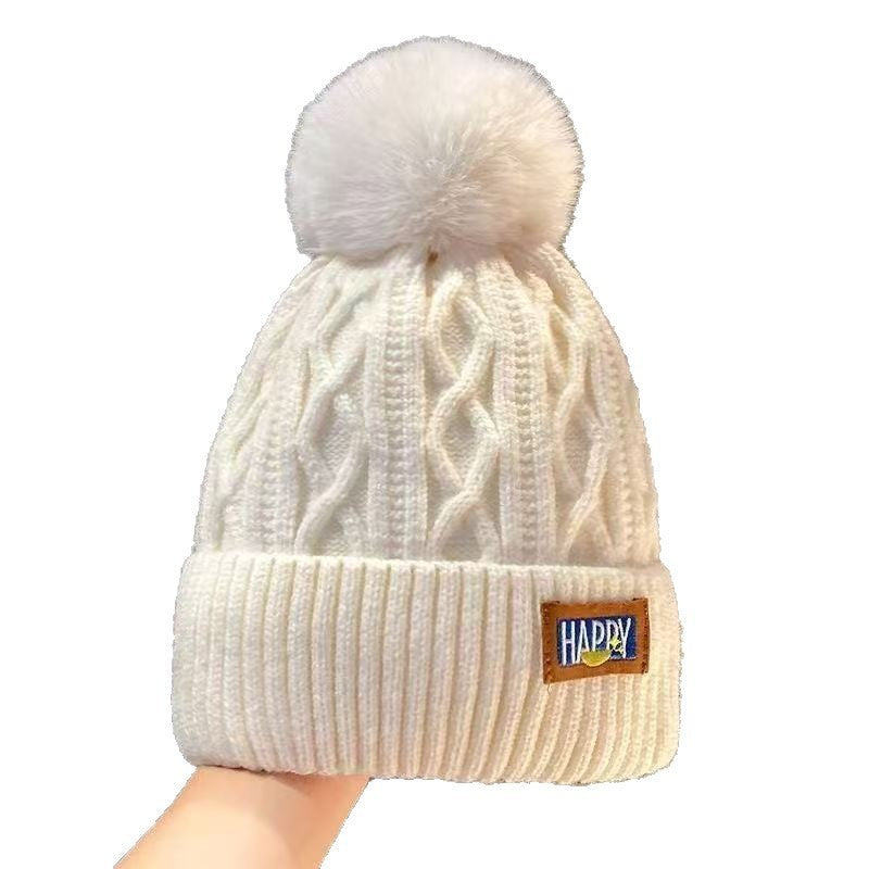 Fleece-lined pom beanie by Glow Ritual