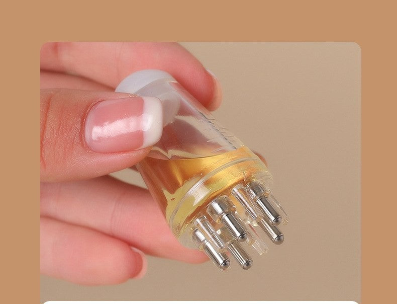 Scalp oil applicator comb by Glow Ritual