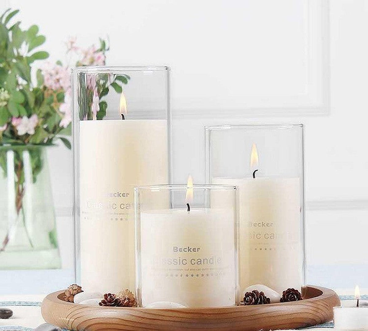 Empty glass candle jars with bamboo lids by Glow Ritual