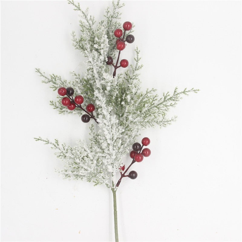 Artificial cedar and red berry picks by Glow Ritual