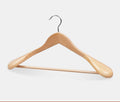 Wide shoulder wooden coat hangers by Glow Ritual