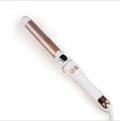 Auto rotating curling iron by Glow Ritual