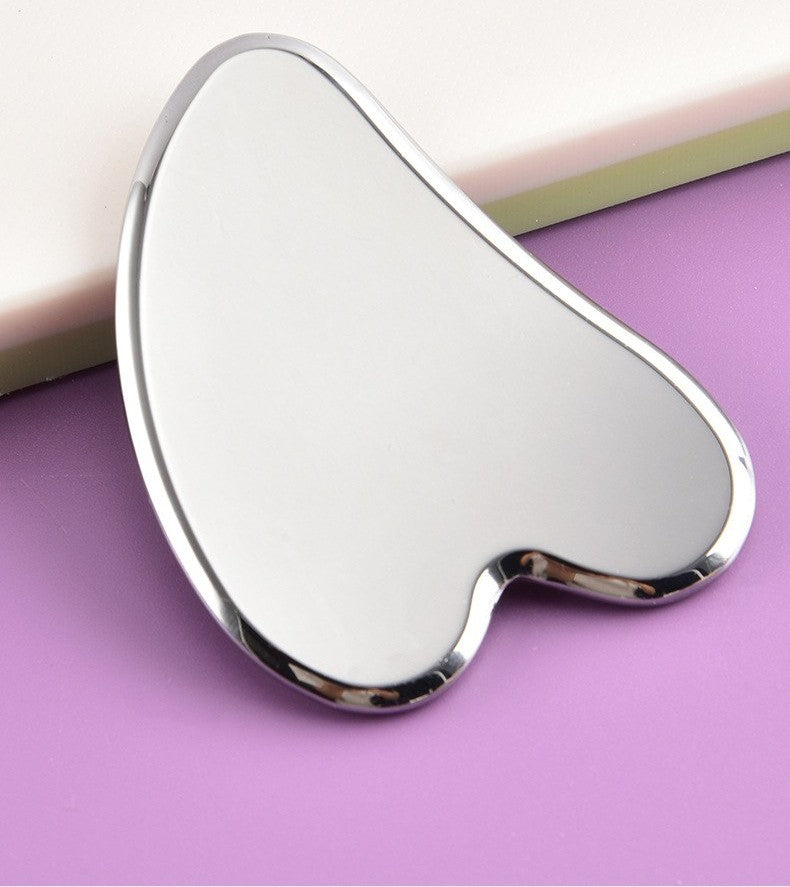 Stainless steel gua sha tool by Glow Ritual