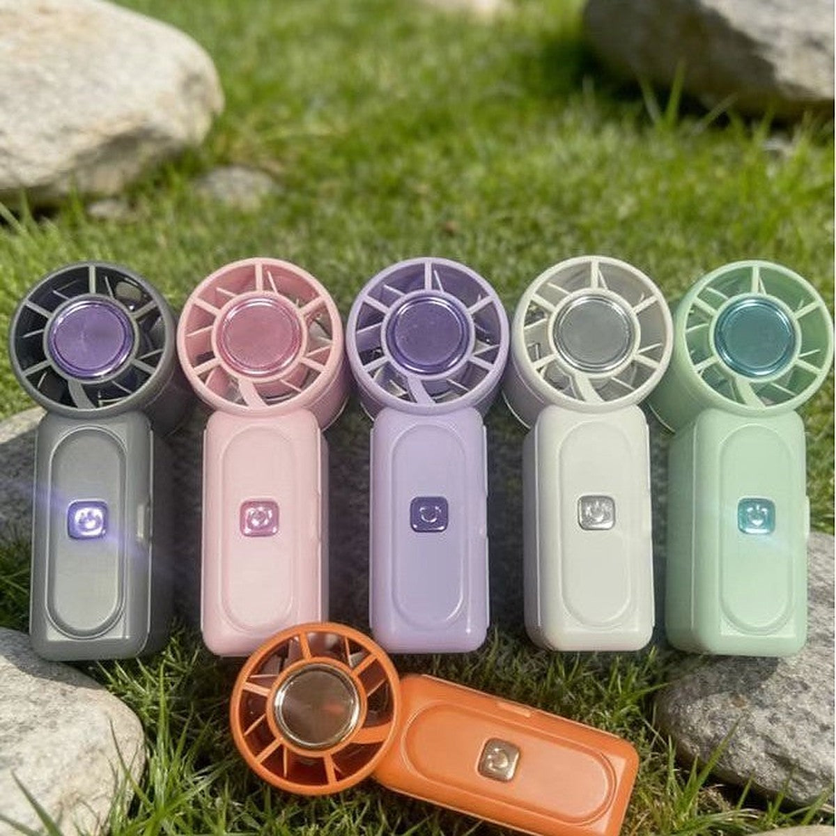 Mini handheld fan by Glow Ritual