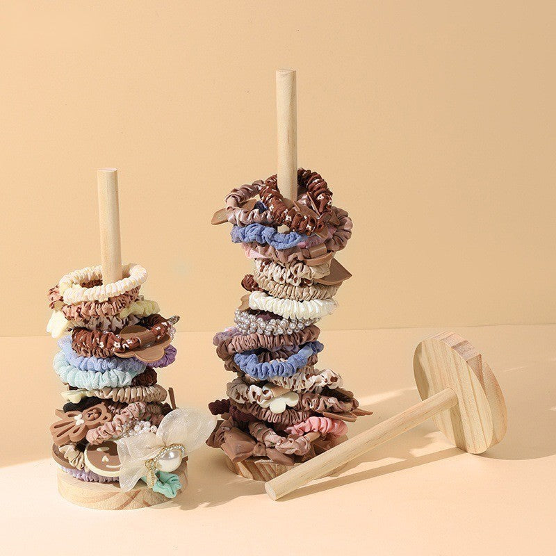 Wooden scrunchie holder stand by Glow Ritual