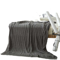 Cable knit throw blanket by Glow Ritual