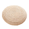Woven straw meditation cushion by Glow Ritual