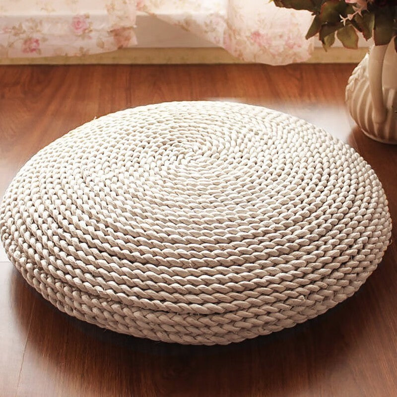 Woven straw meditation cushion by Glow Ritual