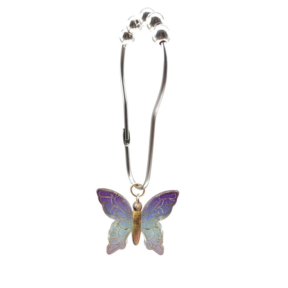 Butterfly shower curtain rings by Glow Ritual