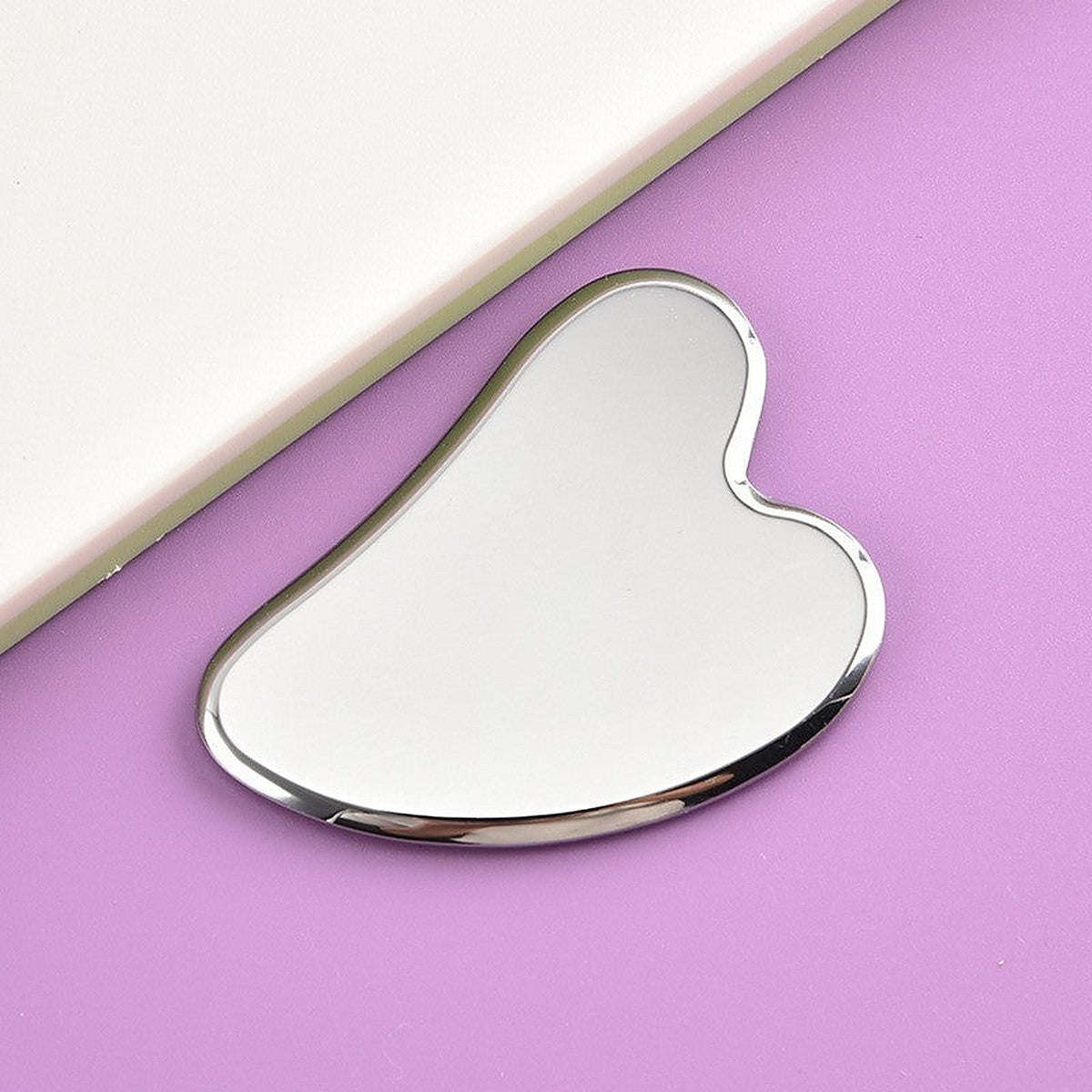 Stainless steel gua sha tool by Glow Ritual