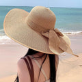 Wide brim straw sun hat by Glow Ritual