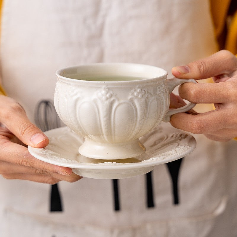 Embossed teacup and saucer by Glow Ritual
