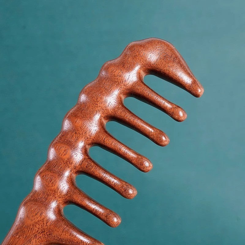 Wide-tooth sandalwood comb by Glow Ritual