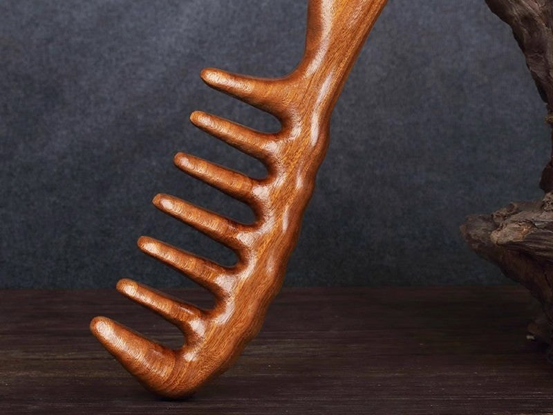 Wide-tooth sandalwood comb by Glow Ritual