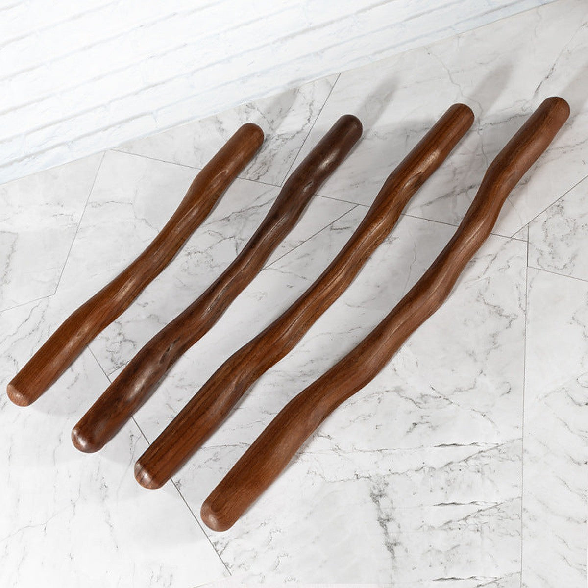 Wooden gua sha body massage stick by Glow Ritual
