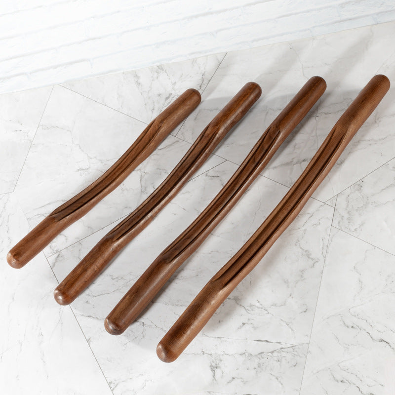 Wooden gua sha body massage stick by Glow Ritual
