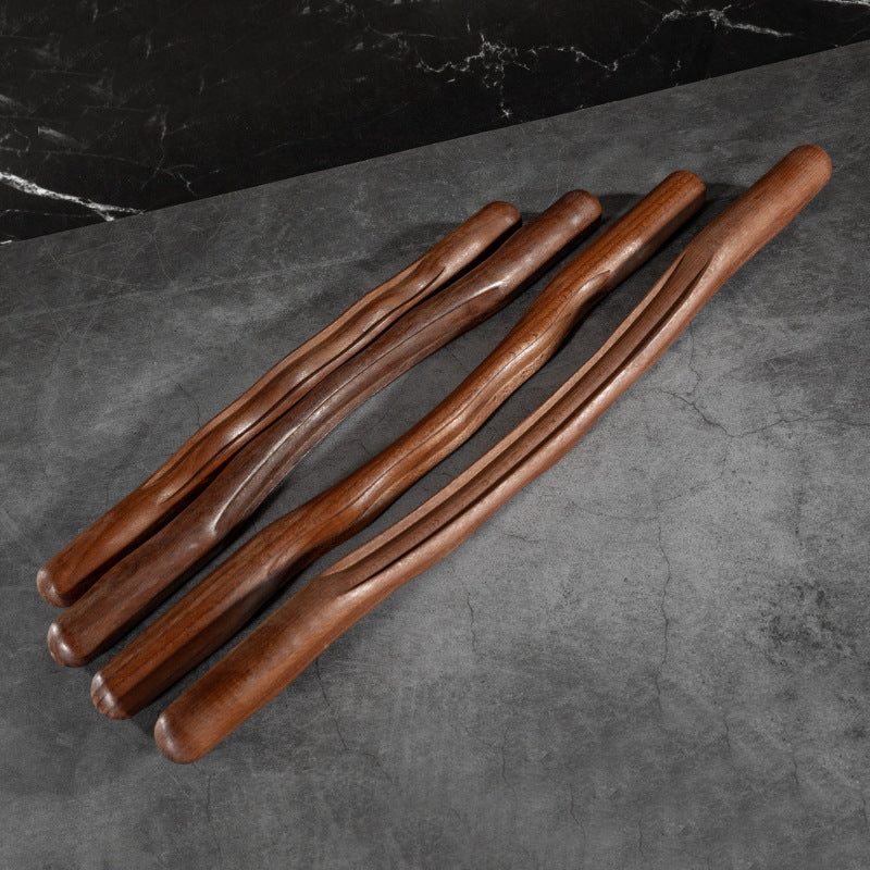 Wooden gua sha body massage stick by Glow Ritual